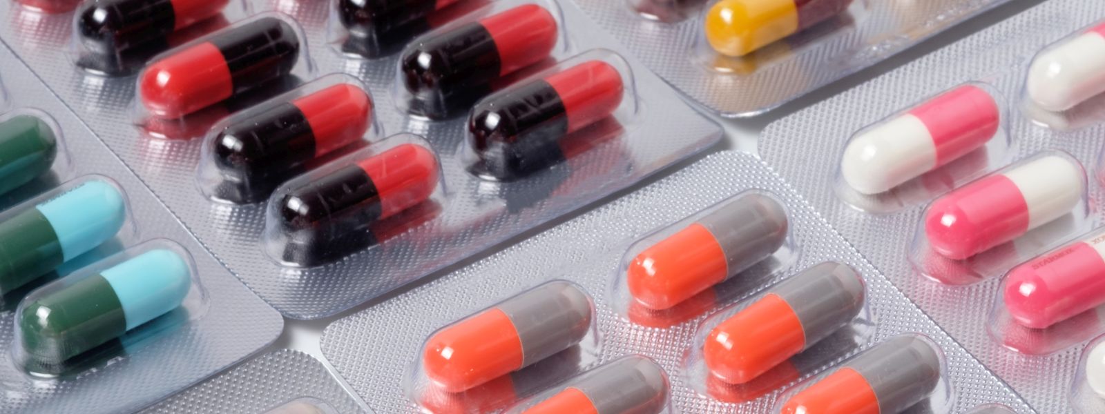 Foil packets containing multi-coloured medicine capsules Foil packets containing multi-coloured medicine capsules